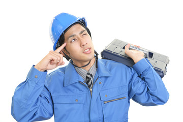 疲れた表情の労働者