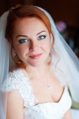 Portrait of red-haired bride