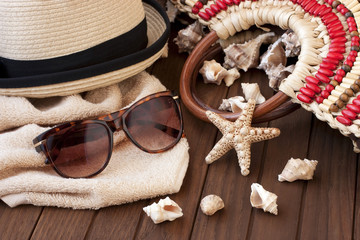  Sunglasses and wicker hat on table. 
