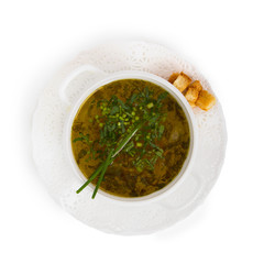 Chicken soup with chives and croutons