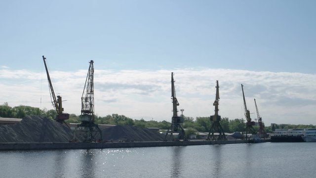port cranes against sky