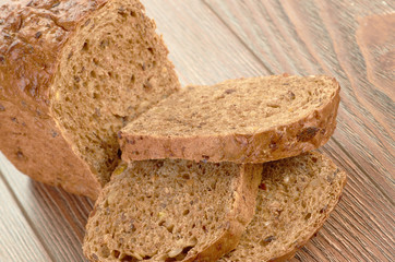 Slices of brown bread on table