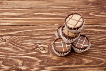 Dark chocolate on wooden background