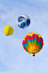 Colorful hot-air balloons flying over the mountain
