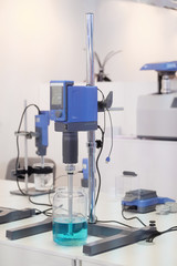 Laboratory equipment. Blue chemical substance in the beaker. 