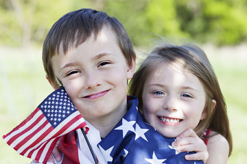 4th of july holiday: happy children with American flag 