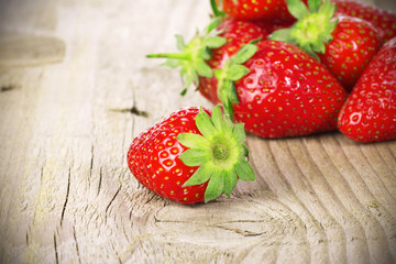 strawberries on old wooden background