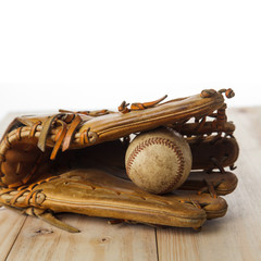 Old baseball glove with baseball