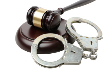 Gavel and handcuffs on a white background