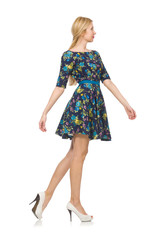 Woman in dark blue floral dress isolated on white