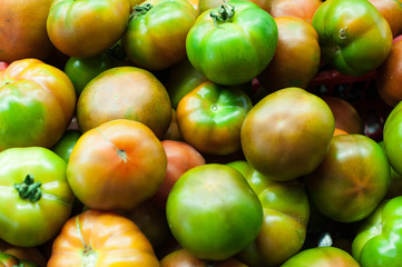 Fresh tomatoes heap in market