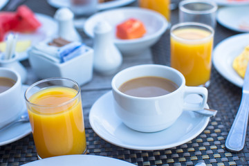 Delicious tasty cappuccino and fresh juice for breakfast at