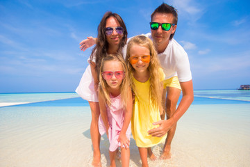 Beautiful family during summer tropical vacation