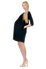 Pretty pregnant woman in mini black dress isolated on white