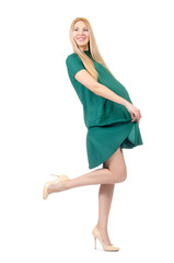 Beautiful pregnant woman in green dress isolated on white