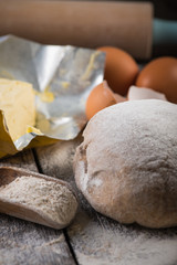 Baking on rustic table, dough and ingredients