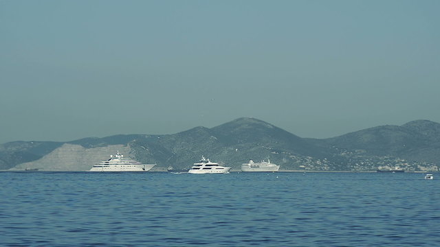 Luxury boats on the background of the island