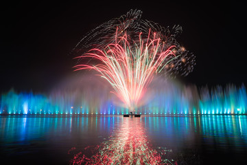 fireworks with reflection in the lake