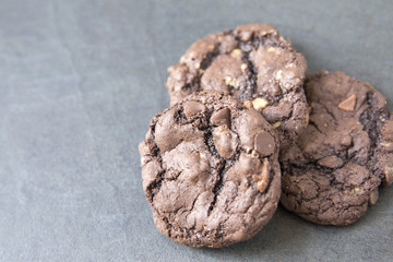 Chocolate chip cookies on slate background