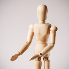Wooden mannequin for painting on a white background