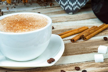 Cappuccino coffee in a cup on a table