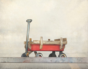 Red pull trolley toys, old rusty wagon, Vintage color tone 