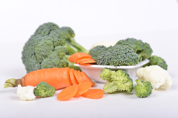 Green broccoli and carrot cut in pieces