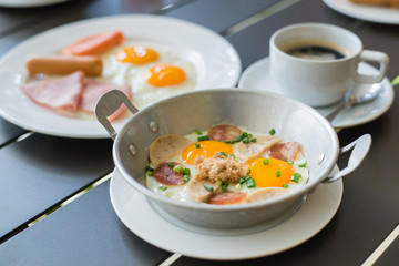 egg dish Breakfast served with fried egg, ham, orange juice, del
