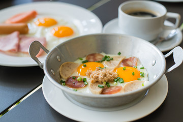 egg dish Breakfast served with fried egg, ham, orange juice, del