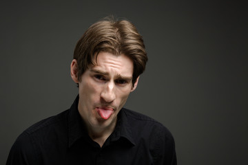 Fototapeta premium Model isolated sticking tongue out