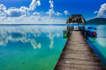 Fotobehang Beautiful pier at Lake Peten - Guatemala © Simon Dannhauer