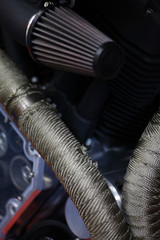 Fototapeta na wymiar Motorcycle exhaust and air filter