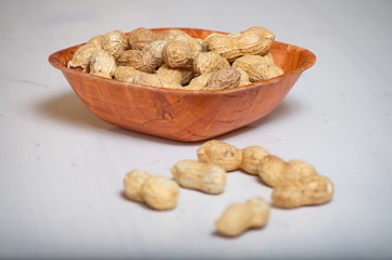 Peanuts in a brown bowl