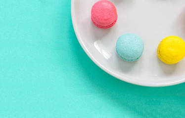 colorful macaron on green background