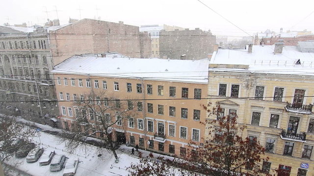 Aerial view from a window at the winter street
