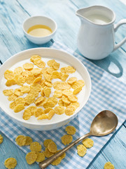Cornflakes cereal and milk.