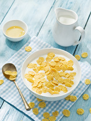 Cornflakes cereal and milk.