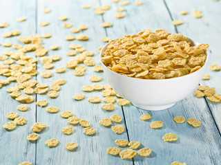 Cornflakes cereal in the white bowl.