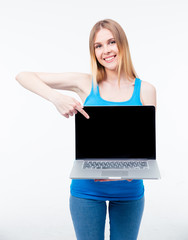 Woman pointing finger on the laptop screen