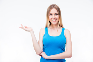 Fototapeta premium Smiling woman presenting something on the palm