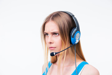 Angry young woman operator in headset