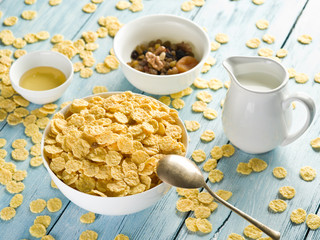 Cornflakes cereal and milk.