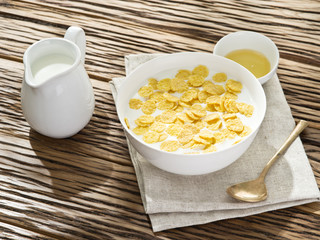 Cornflakes cereal and milk.