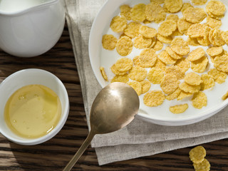 Cornflakes cereal and milk.