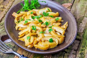 Fried mushrooms with fresh parsley