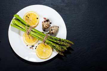Asparagus on a dark surface. Food background