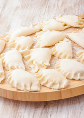 Fototapeta na wymiar Fresh homemade dumplings ready to cooking