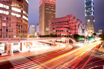 Fototapeta na wymiar traffic blurred motion and office buildings
