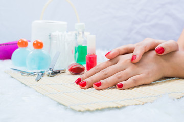 Beautiful manicured woman's nails with red nail polish