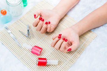 Obraz na płótnie Canvas Beautiful manicured woman's nails with red nail polish